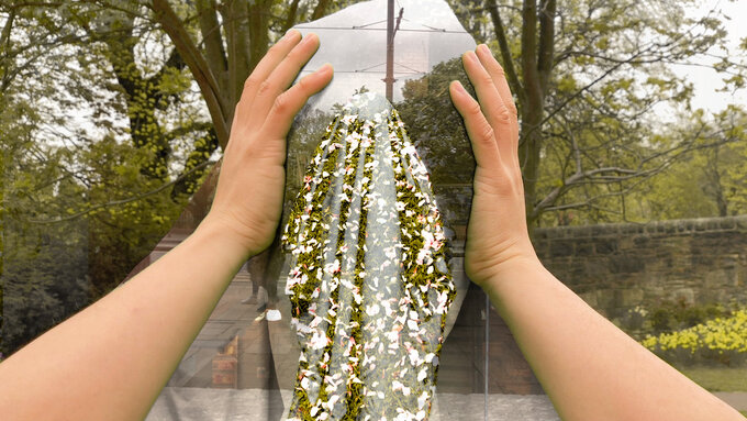 Hands holding a head covered with an abstract green and flowery background.