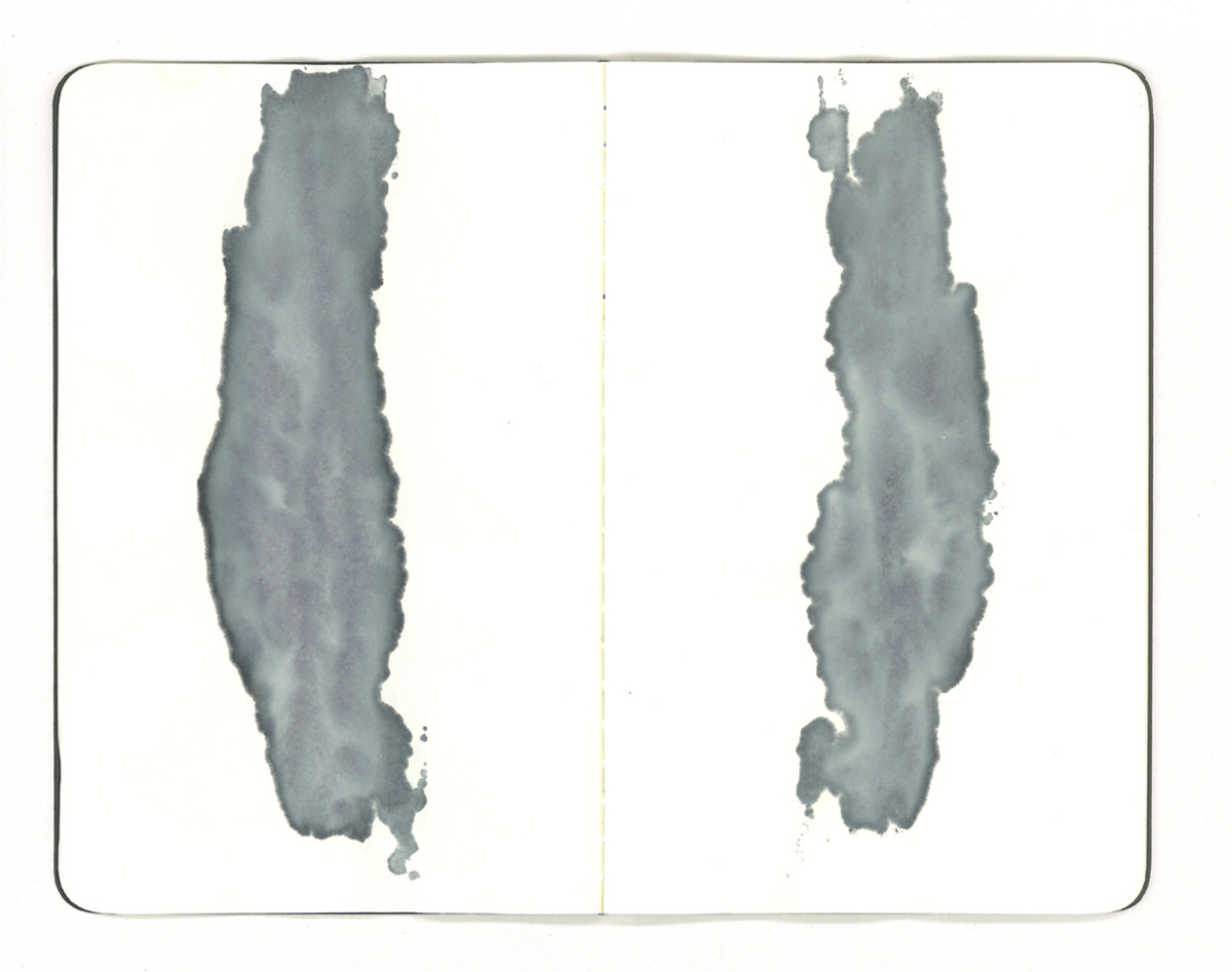 A white image with two blue-grey watercolour streaks facing each other.