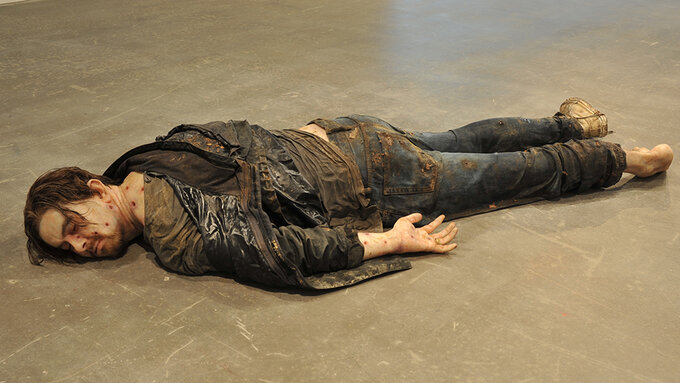 A sculpture of a decomposing drowned man.