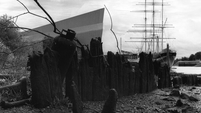 A black and white image of Glasgow's Transport Museum and Tall Ship taken from afar.
