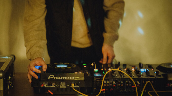 Close-up of DJs hands on deck during a #GSFF22 event