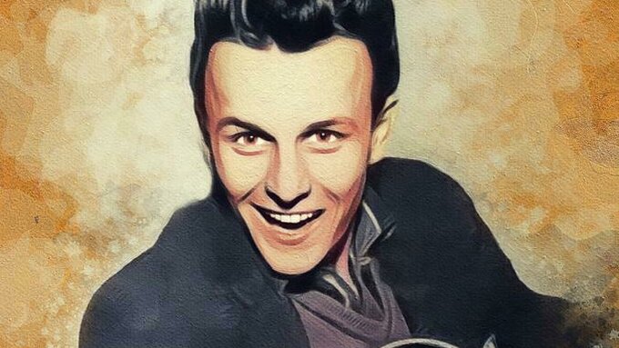 Charlie Gracie, Music Legend is pictured with an electric guitar and a winning smile