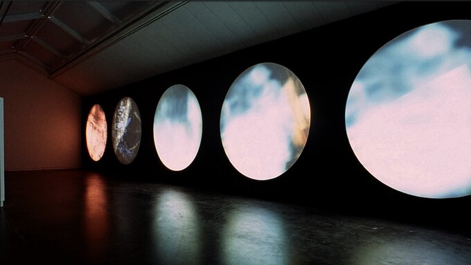 5 circular screens in a row set up in the CCA3 gallery space.