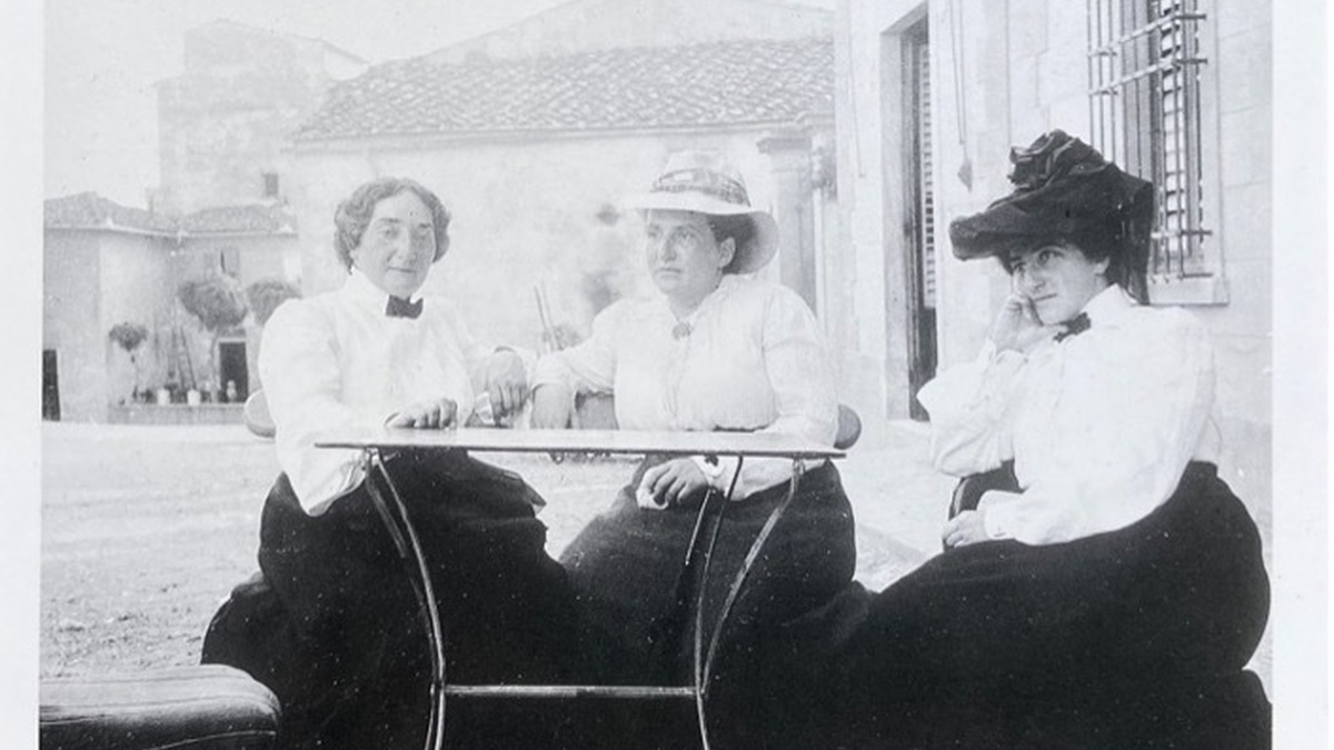 Claribel Cone, Gertrude Stein, and Etta Cone seated at a table