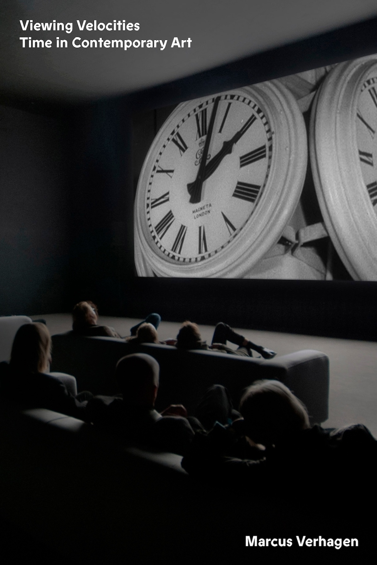 A black and white book cover of a cinema scene with people watching a screen filled with clocks