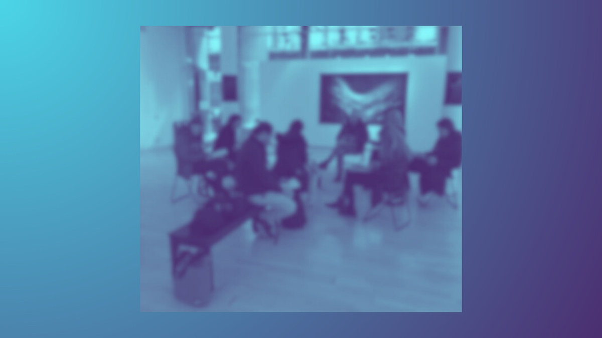 A blurred blue image of the 'Writing the World' Creative Writing Class