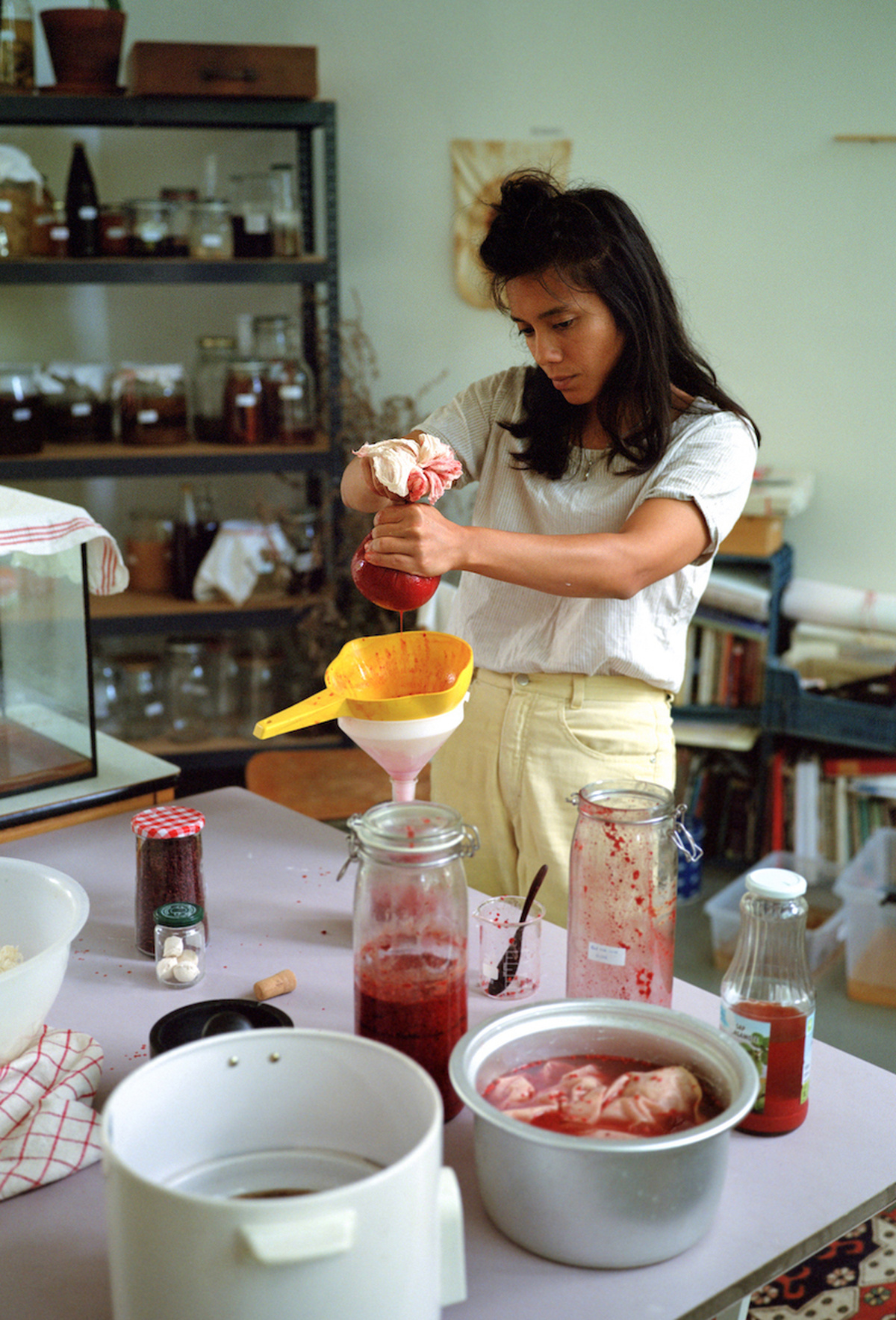 Asli Hatipoglu prepares jam in their kitchen.