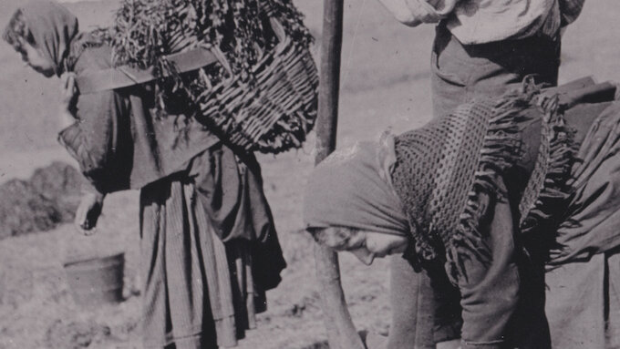 Old black and white image of Hebridean crofters working on their land.