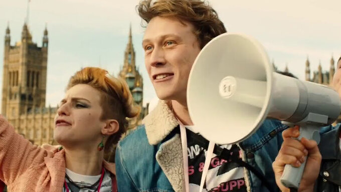 Protesters in the street with megaphone marching in front of Westminster.