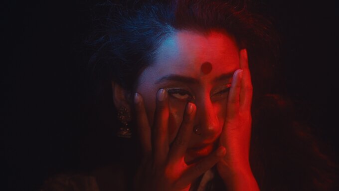 Closeup of hands on a dancer's face