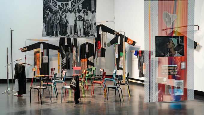 An installation featuring textiles, fabric and furniture.