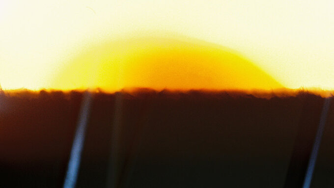 An abstract image evoking a sunrise.