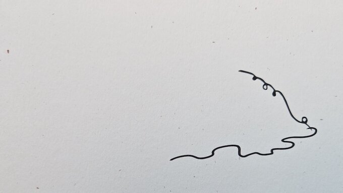 Textured paper, in the lower third with a single squiggling hand-drawn line flowing along.