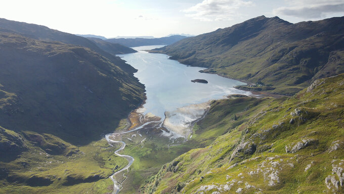A photo of a deep loch taken at the top of a monro.