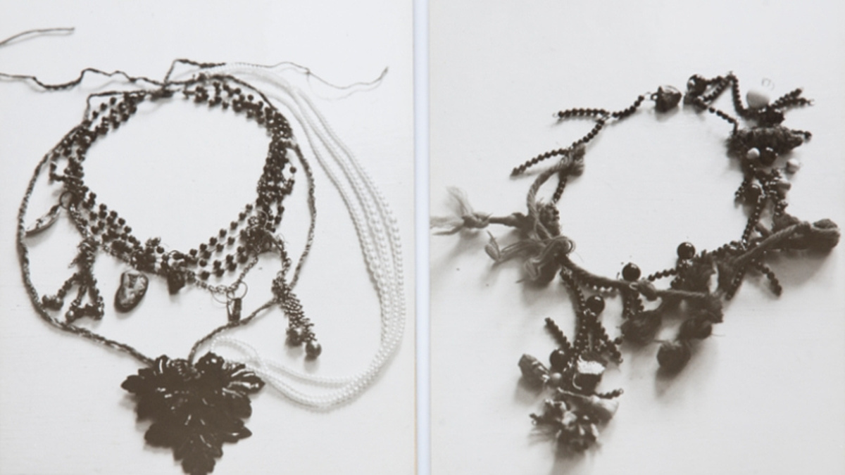 Two photographs of necklaces laid out on a white surface, they are both intricately jewelled.