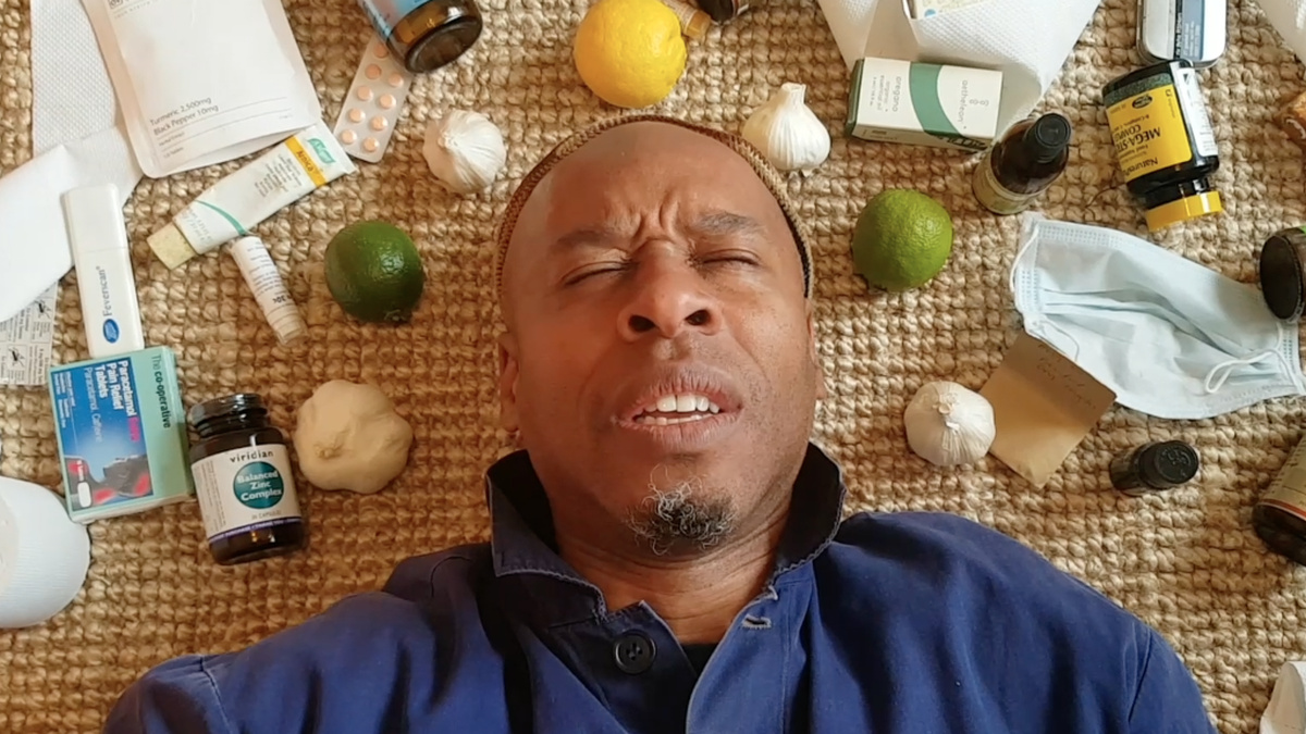 Musician Art Terry surrounded by pills and remedies, in recovery from Covid-19.