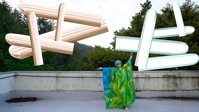 A figure draped in green silk spreads their wings, gaze turned to the sky. They paint florescent streaks into the air.